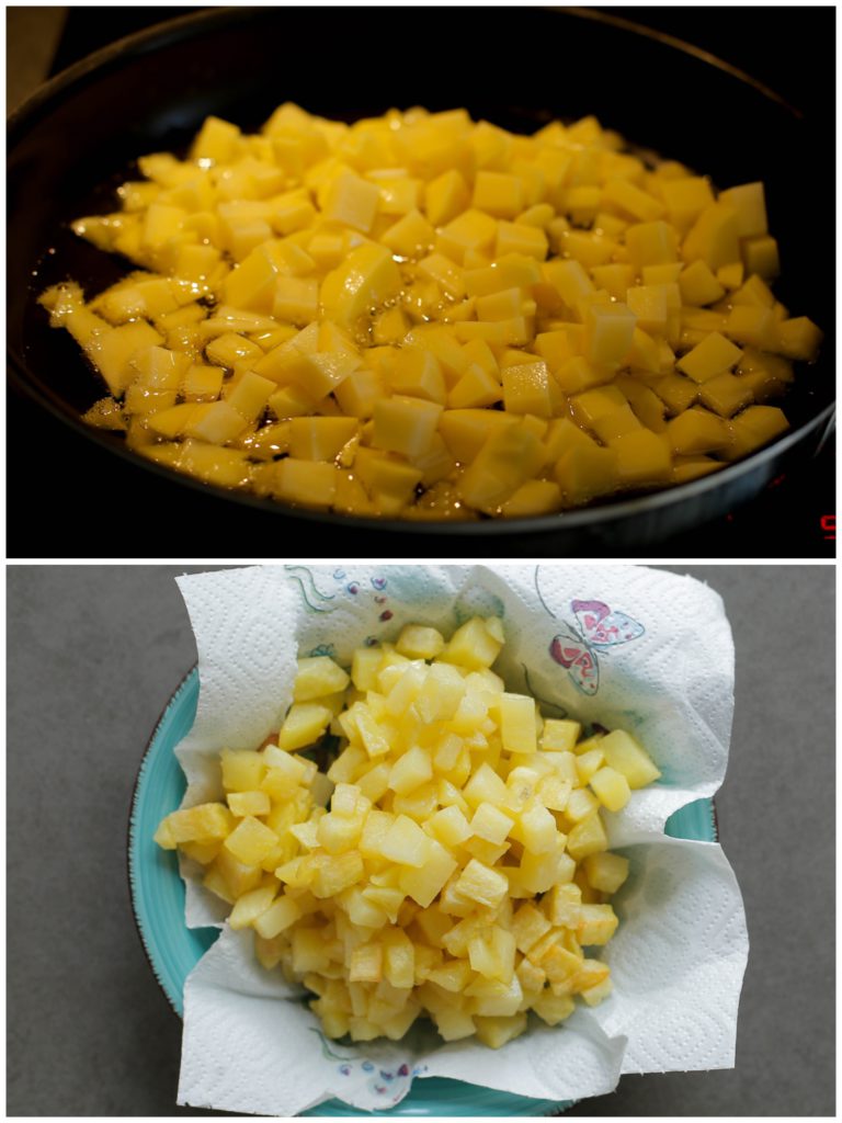 Verhit een laagje zonnebloemolie in een pan op middelhoog vuur (175 graden). Bak de aardappels gaar. Schep de aardappelblokjes eruit en laat deze uitlekken op een vel keukenpapier.