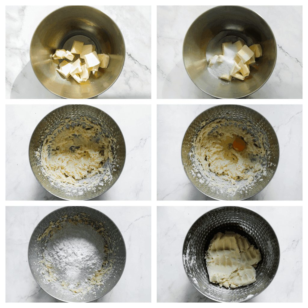 Doe de zachte roomboter in een diepe kom. Voeg de suiker, vanillesuiker en het zout toe. Mix in ca. 3 minuten tot een luchtig beslagje. Voeg het ei toe en mix 1 minuut. Voeg de bloem, maïzena en het bakpoeder toe. Mix/kneed tot een mooie koekjesdeeg.