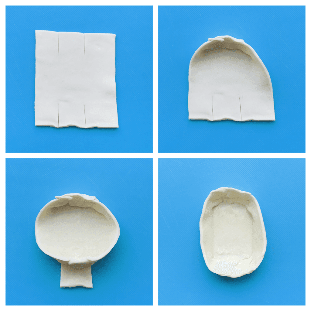 Neem een stuk bladerdeeg (vierkant) en snijd deze tweemaal aan de onderkant én bovenkant. Vouw het bladerdeeg naar binnen tot een bootje. 