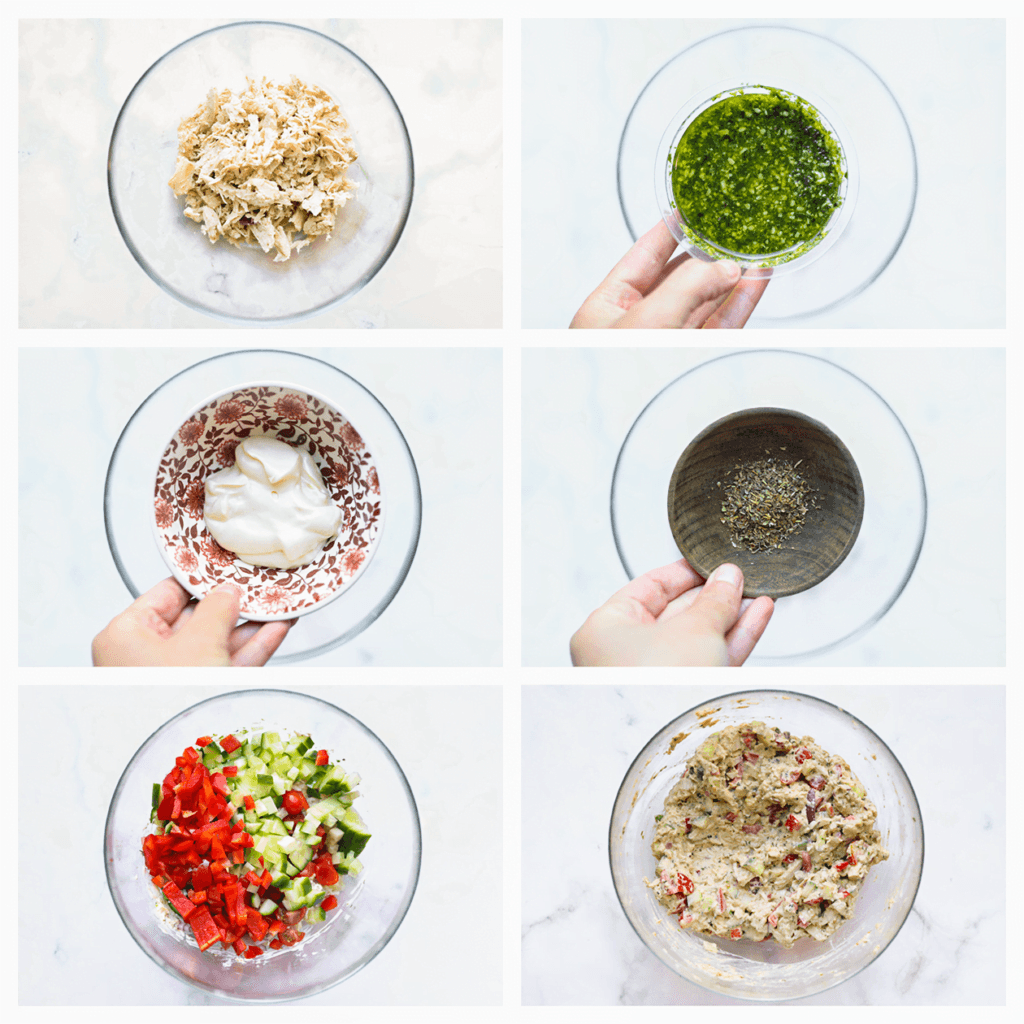 Doe de geplukte kip in een diepe kom. Voeg de groene pesto, mayonaise en Italiaanse kruiden toe en meng alles goed door elkaar. Voeg de rode ui, rode paprika, snoeptomaatjes en komkommer toe en meng opnieuw tot een geheel. Voeg zout en peper toe naar smaak.