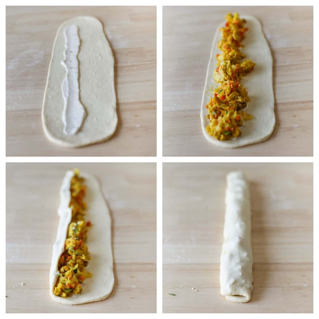 Smeer saus naar keuze over de lengte van het deeg en verdeel vervolgens een portie van het kipmengsel er gelijkmatig overheen. Rol het deeg vervolgens stevig op, zodat het kipmengsel volledig is ingepakt.