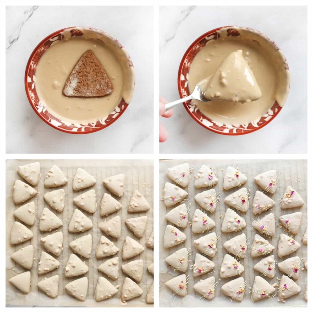 Dompel de chocoladedriehoekjes in de chocolade en leg ze op een vel bakpapier. Herhaal deze werkwijze voor alle driehoekjes. Garneer de koekjes vervolgens met witte chocoladestreepjes, gehakte hazelnoten en rozenblaadjes. Laat de chocolade vervolgens stevig worden.