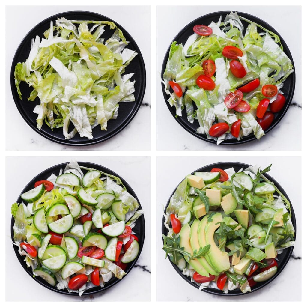 Verdeel de ijsbergsla over een bord. Voeg de komkommer, snoeptomaatjes en avocado toe. Leg de burrata in het midden. Garneer met pijnboompitten, croutons, rucola en salade kruiden. Leg de kipspiesjes bovenop de salade. Besprenkel naar smaak met bieslookdressing.