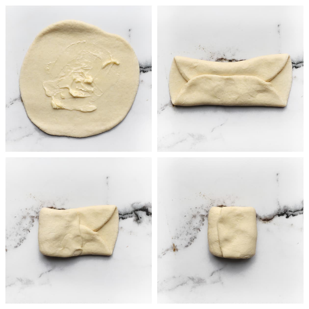 Deeg insmeren met boter en vouwen tot een pakketje