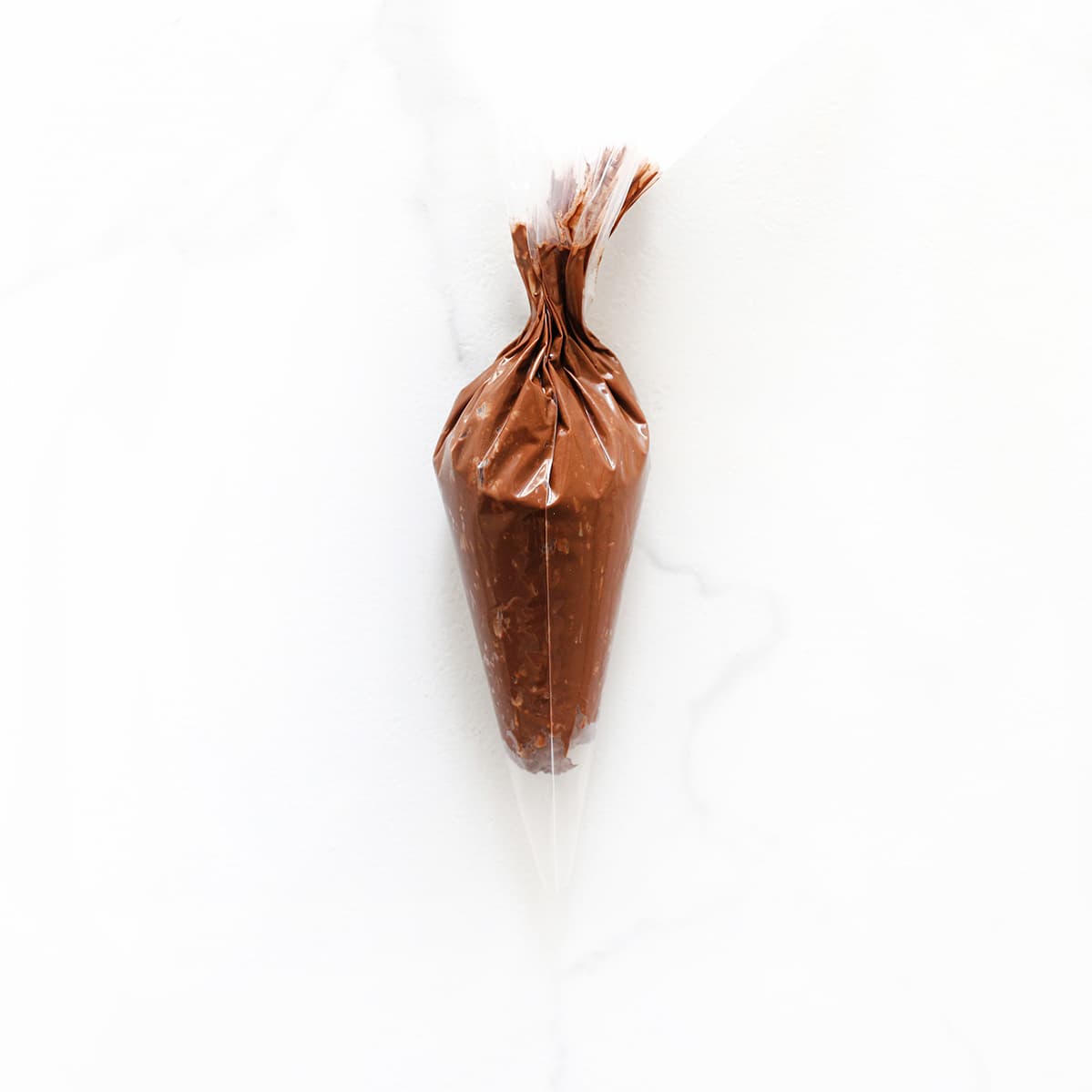 Chocolademengsel in een spuitzak