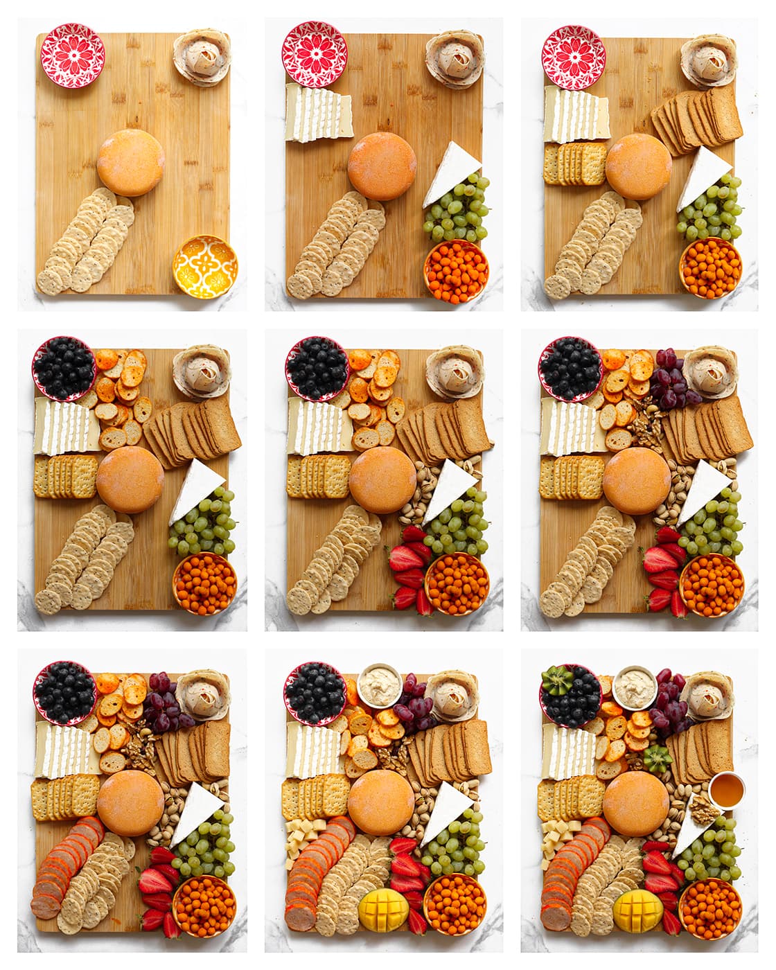 Borrelplank met brie, salami en kaasblokjes op houten plank