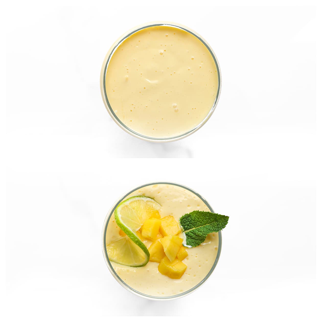 Een glas mango lassi wordt gegarneerd met verse mango, munt en een partje limoen.